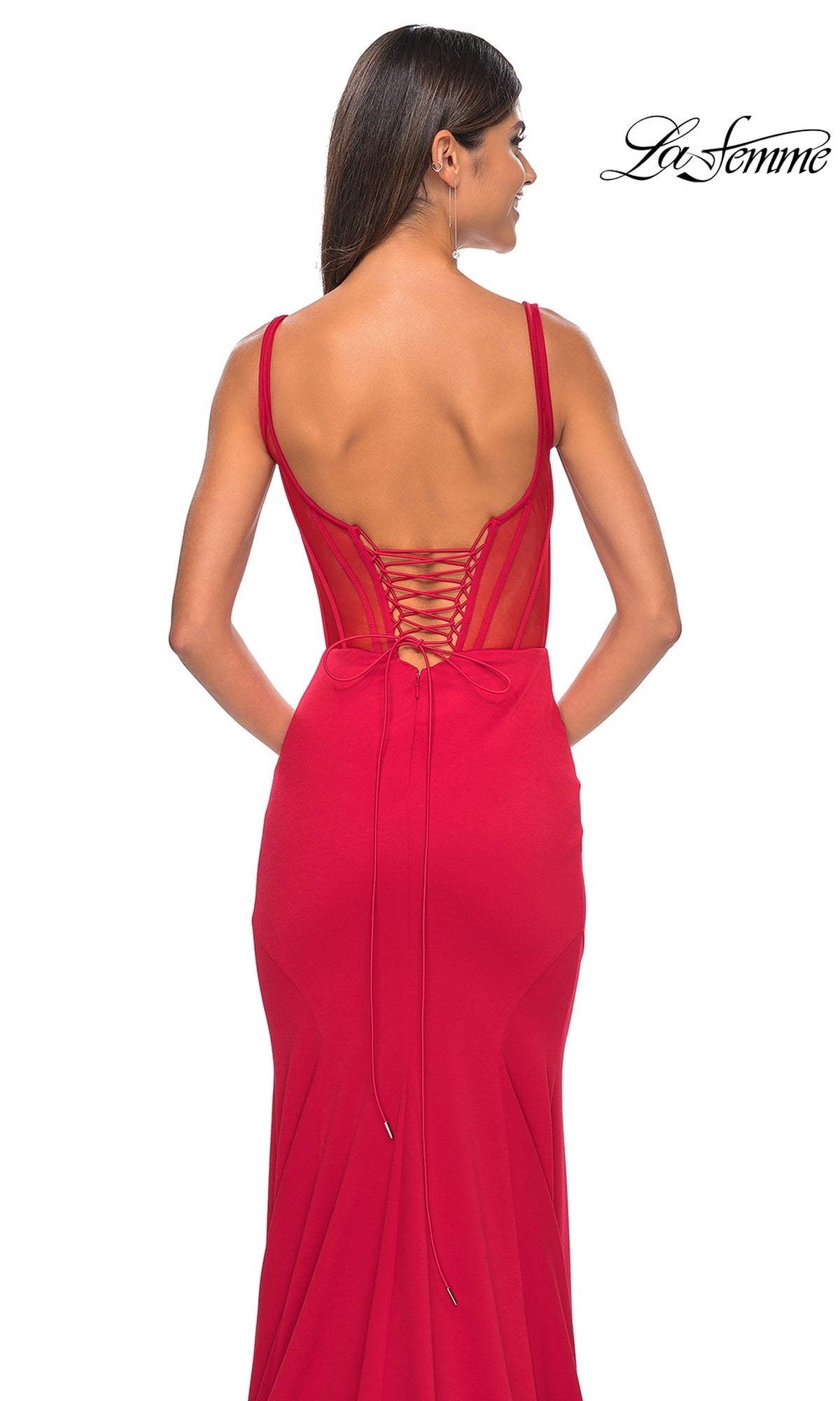 Model showcases the La Femme Lace-Up Sheer Back Long Prom Dress 32268, featuring thin straps, a corset-style bodice, a fitted silhouette, and lace-up back detail, posed elegantly against a plain white background.